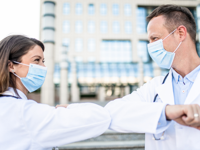 Doctor16 elbow bump.resized